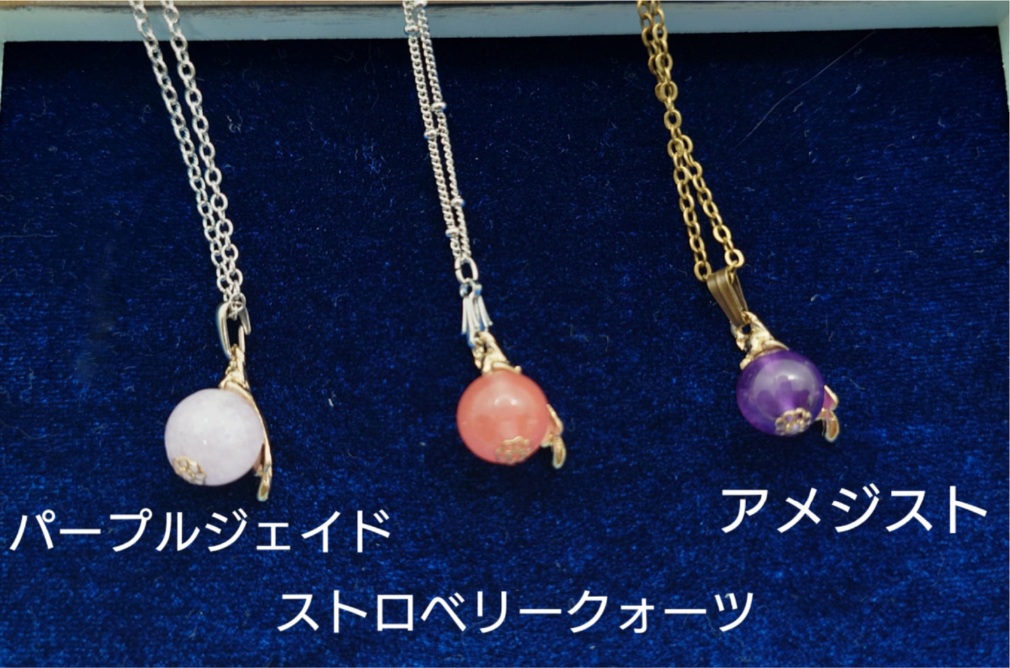 Cat necklace hanging from natural stone