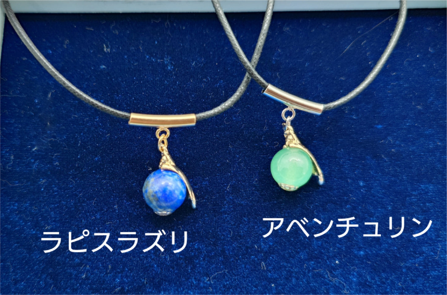 Cat necklace hanging from natural stone